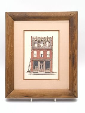 "The Red Brick Storefront" Framed Print